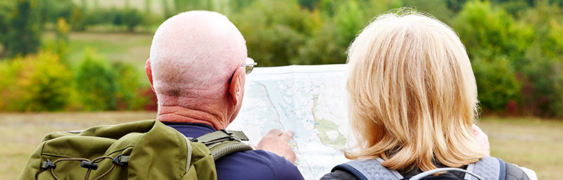 Senior couple looking at map
