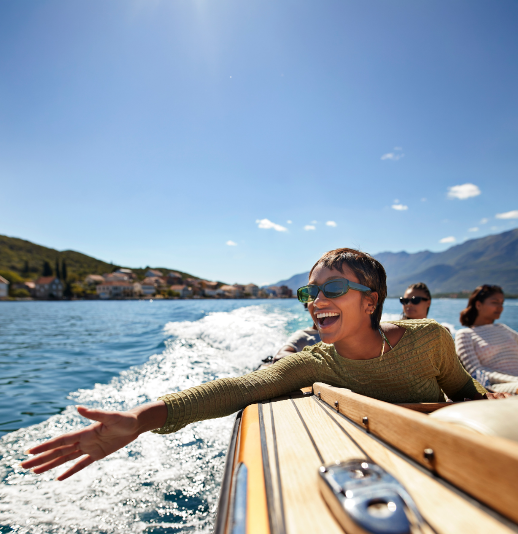 woman in boat with hand out