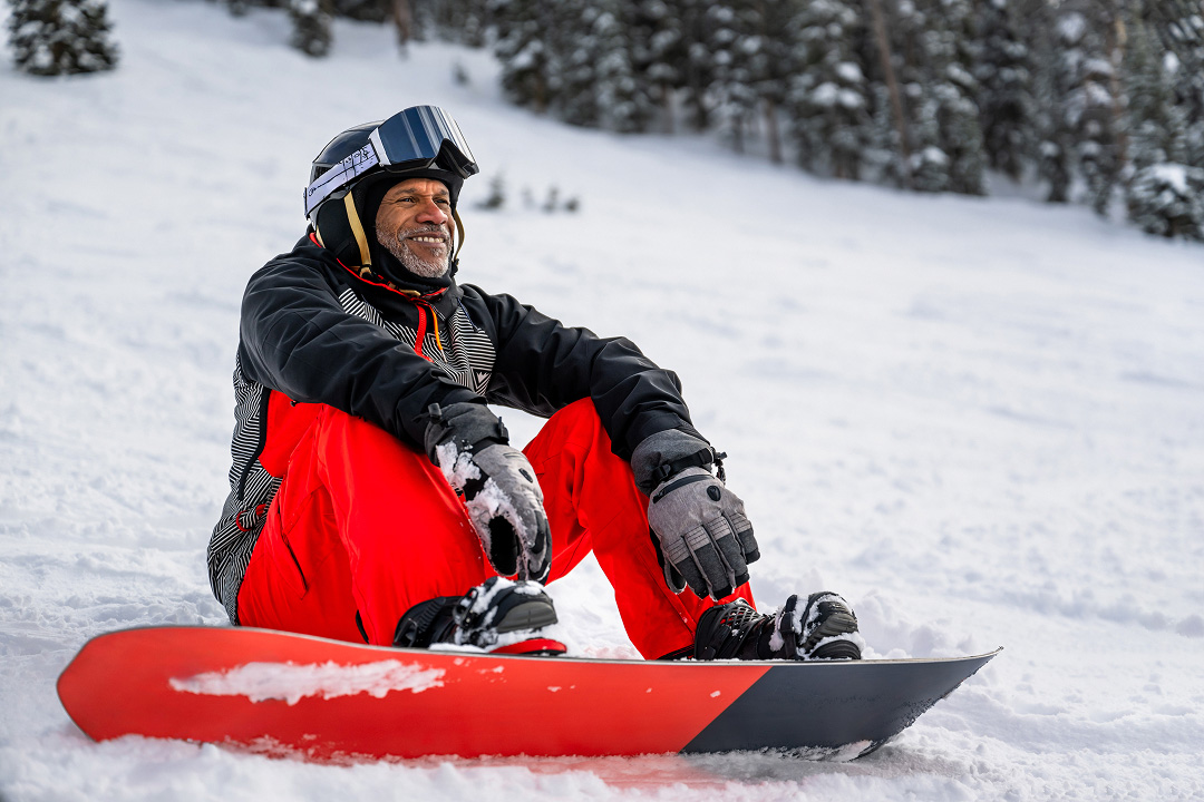 Traveller taking a break from snowboarding
