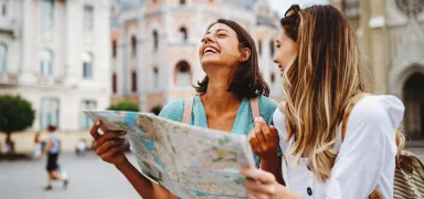 Two girls travelling with map