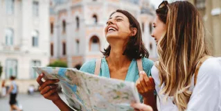 Two girls travelling with map