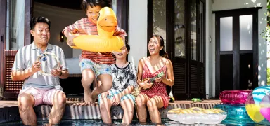 Young family by pool