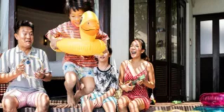 Young family by pool
