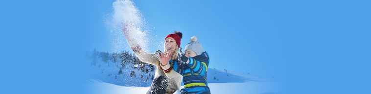 mother and son playing in snow