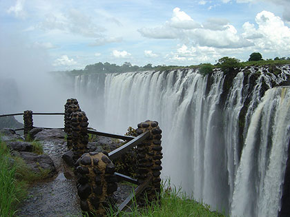 One of the top waterfalls in the world, Victoria Falls in Zambia and Zimbabwe features a wide and nearly-unbroken length of waterfalls for visitors to see.